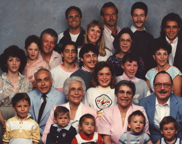 The author's paternal side of the family (23 people) sitting for a photograph.