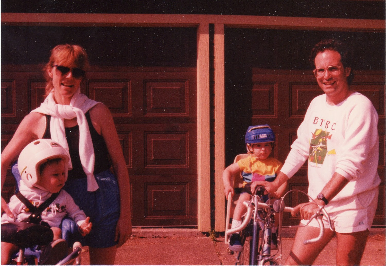 The author's immediate family in front of their garage, getting ready for a bike ride.