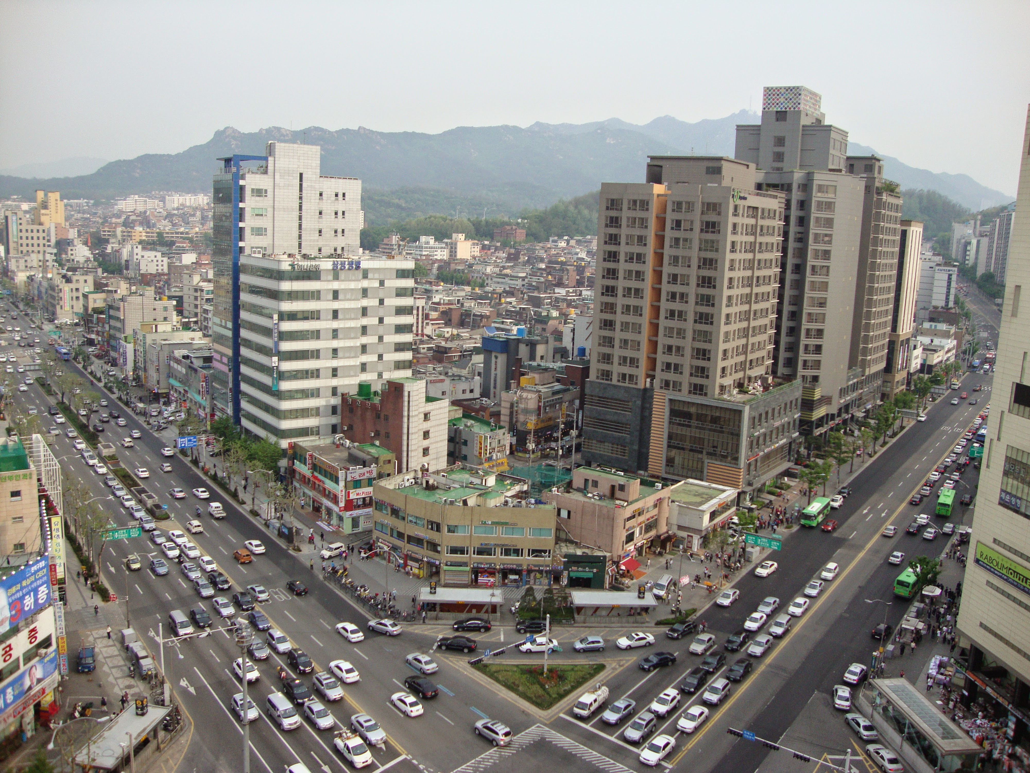 From the roof of the author's apartment building near Seoul National University station, a picture taken in early evening looking south-by-southeast on the intersection at Gwanak-ro & Nambusunhwan-ro.