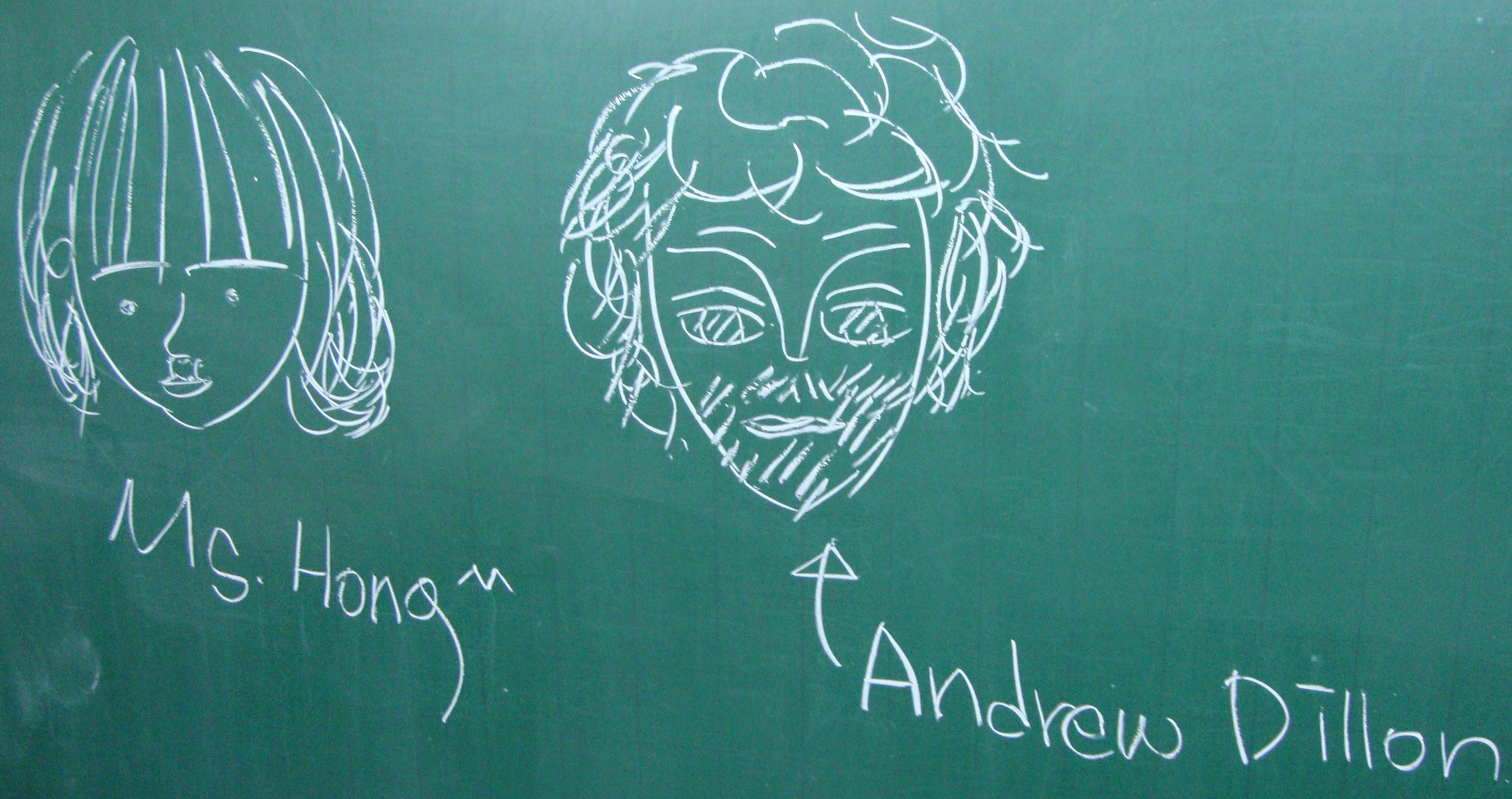 On a classroom blackboard, chalk headshots of teachers Hong Jieun & the author.